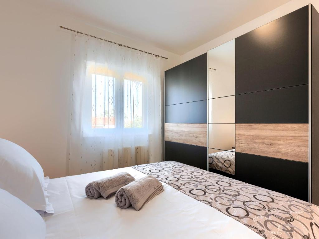 Postel nebo postele na pokoji v ubytování Holiday Home Reaa by Interhome