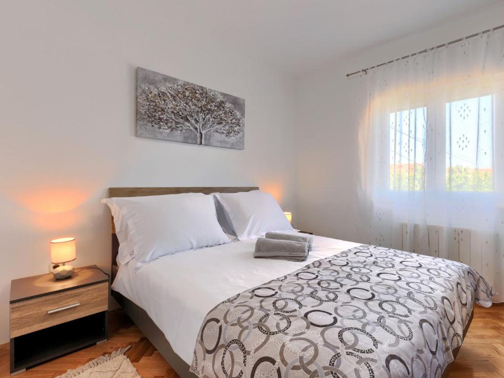Postel nebo postele na pokoji v ubytování Holiday Home Reaa by Interhome