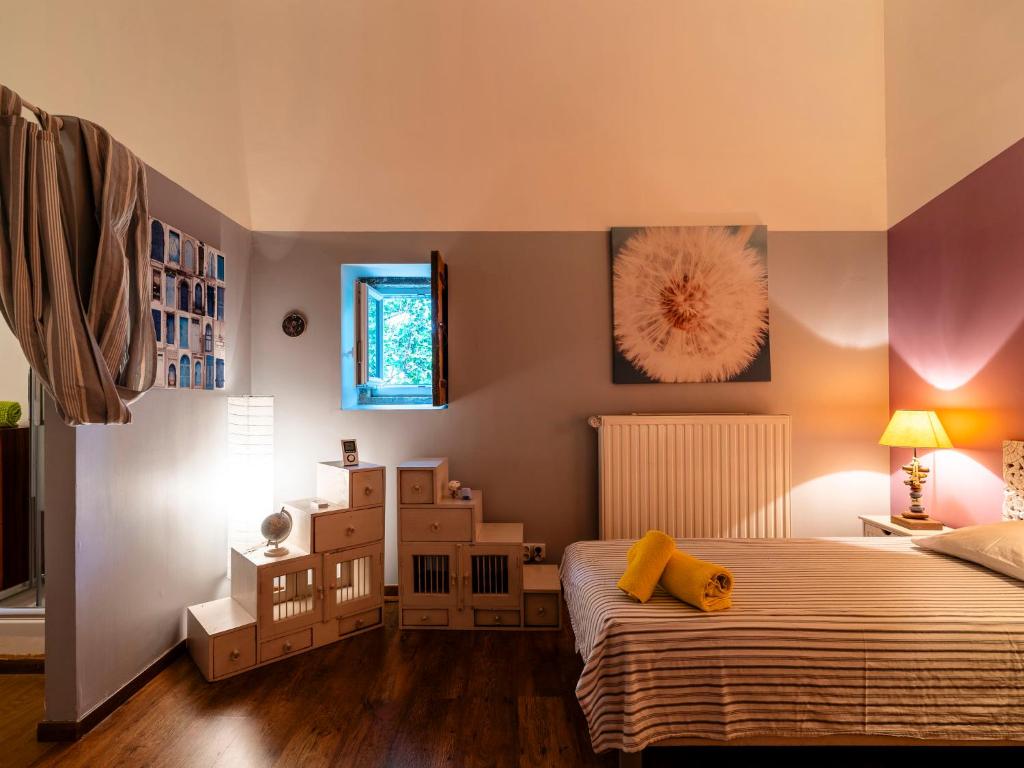 a bedroom with a bed and a room with boxes at Holiday Home Le Mas d&#39;Adélaïs by Interhome in Baron