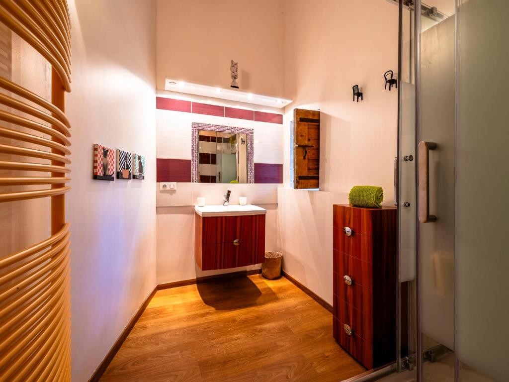 a bathroom with a sink and a mirror at Holiday Home Le Mas d&#39;Adélaïs by Interhome in Baron