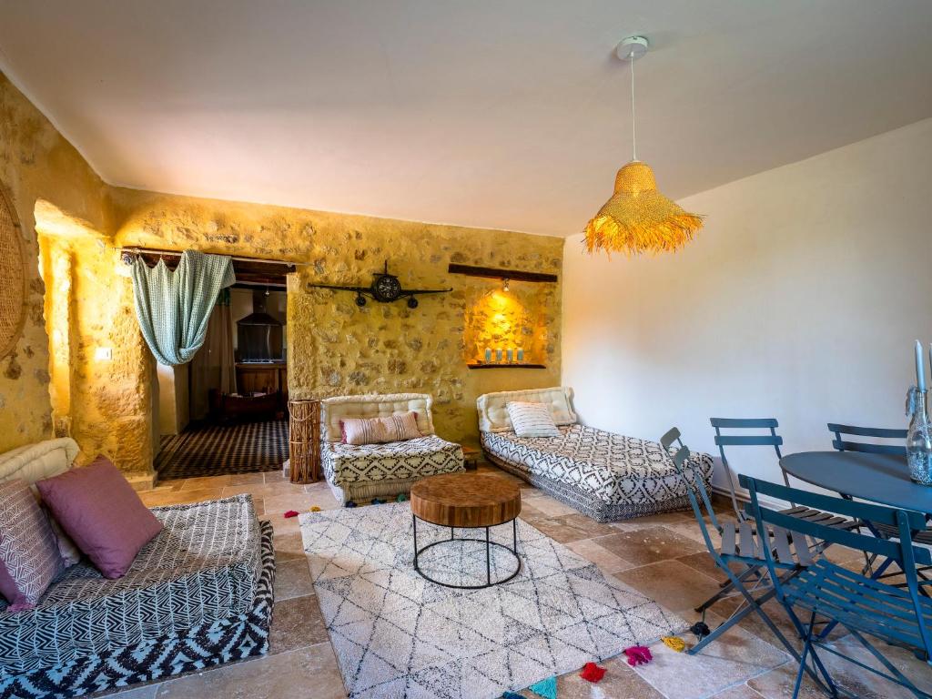 a living room with a couch and a table at Holiday Home Le Mas d&#39;Adélaïs by Interhome in Baron