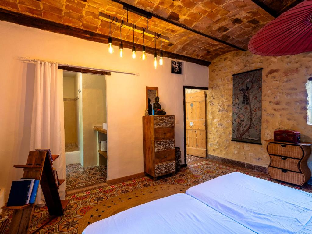 a bedroom with a large bed in a room at Holiday Home Le Mas d&#39;Adélaïs by Interhome in Baron