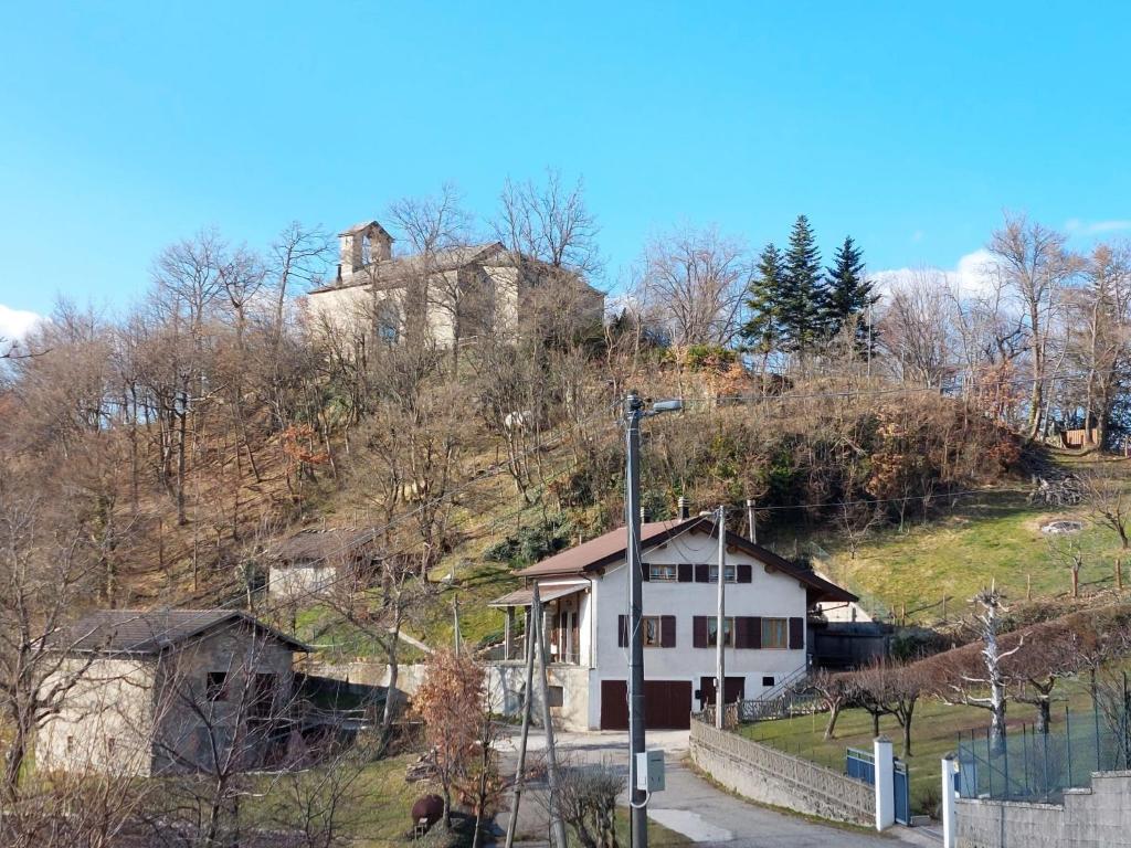 a house on a hill with a house on it at Holiday Home Villa La Chiesa by Interhome in Bosco