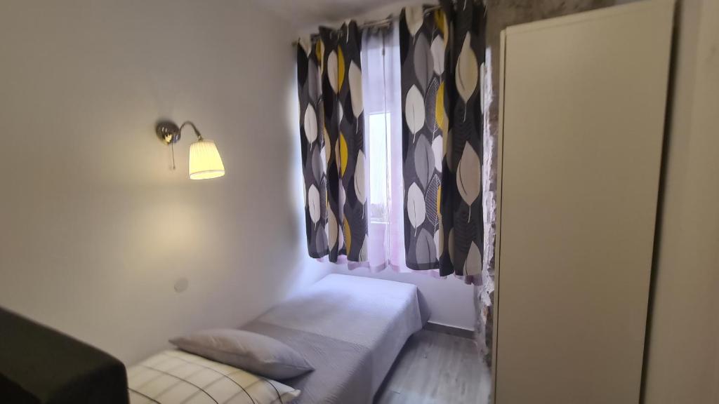Posteľ alebo postele v izbe v ubytovaní Apartman Muracca