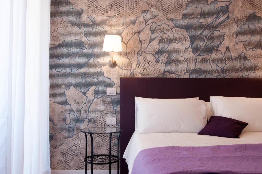 A bed or beds in a room at B&B Roma 474