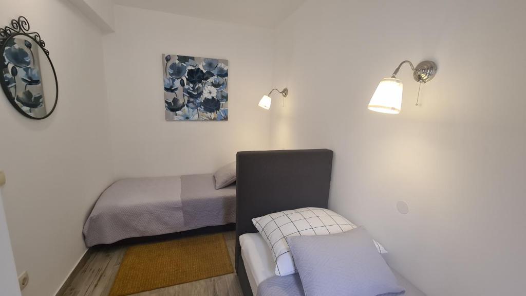 Posteľ alebo postele v izbe v ubytovaní Apartman Muracca