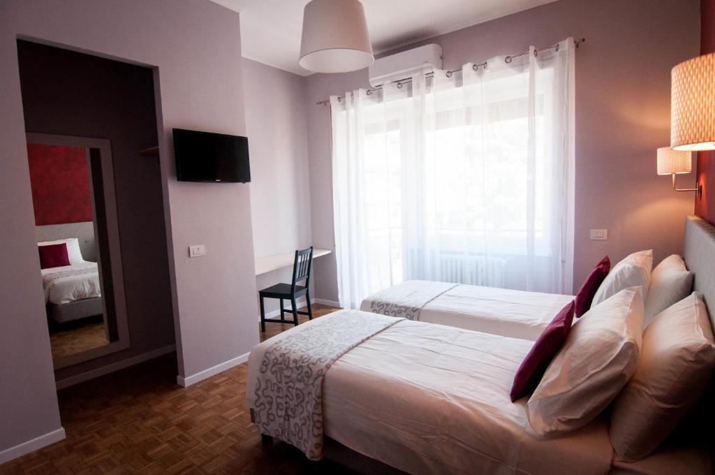 A bed or beds in a room at B&B Roma 474