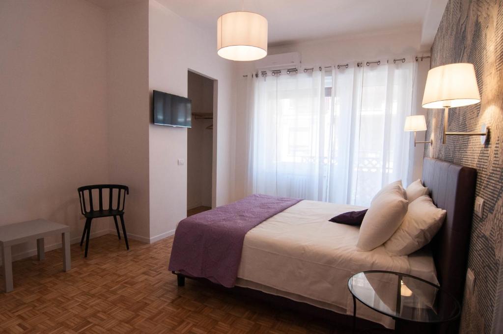 A bed or beds in a room at B&B Roma 474