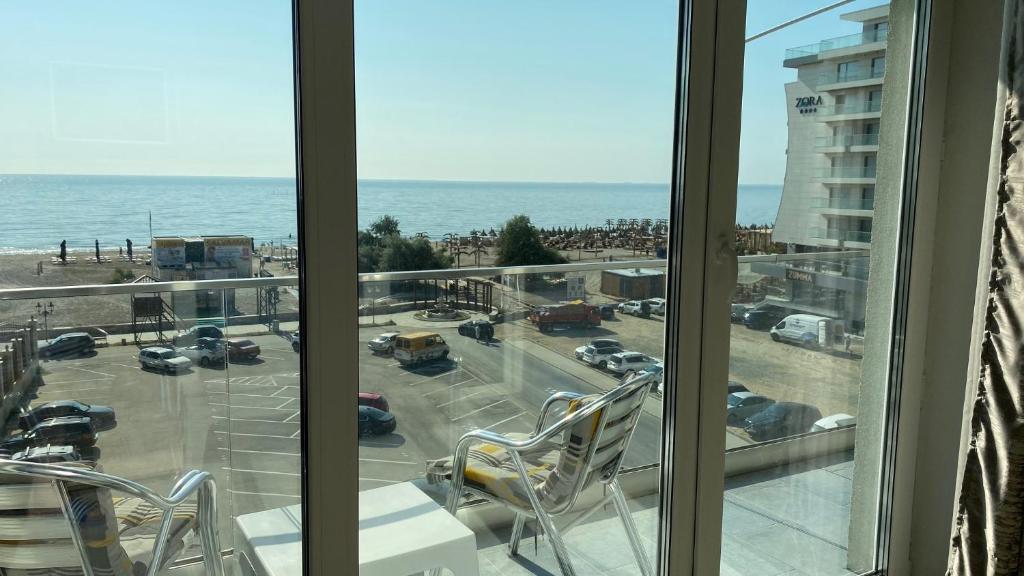 a view of a parking lot from a hotel window at Hanul Piratilor Promenada Apartament in Mamaia Nord