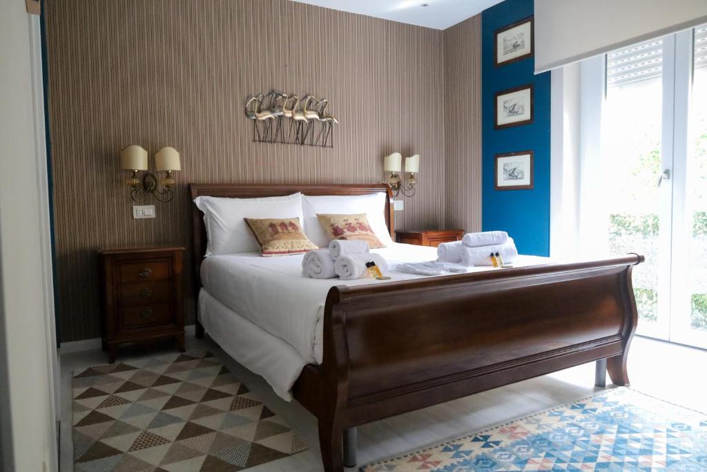 Postel nebo postele na pokoji v ubytování Hermitage Suites