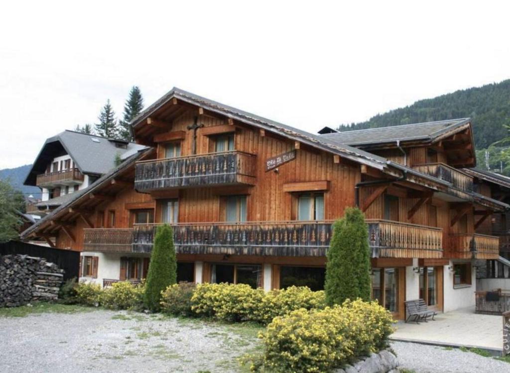 a large wooden building with balconies on it at Rare Chalet 30 Personnes in Morzine