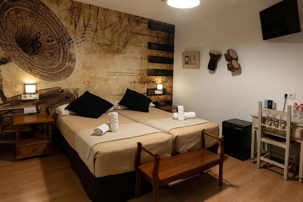 Postel nebo postele na pokoji v ubytování Hotel Alquimia Cadiz