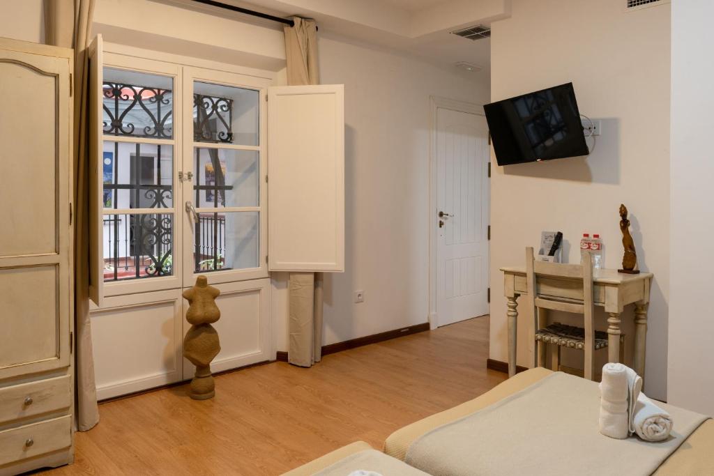 TV a/nebo společenská místnost v ubytování Hotel Alquimia Cadiz