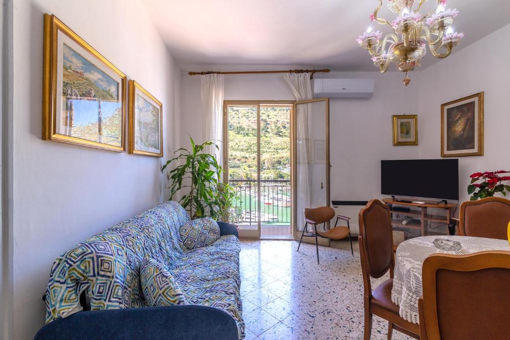 a living room with a couch and a tv at Angolo di cielo in Castellammare del Golfo
