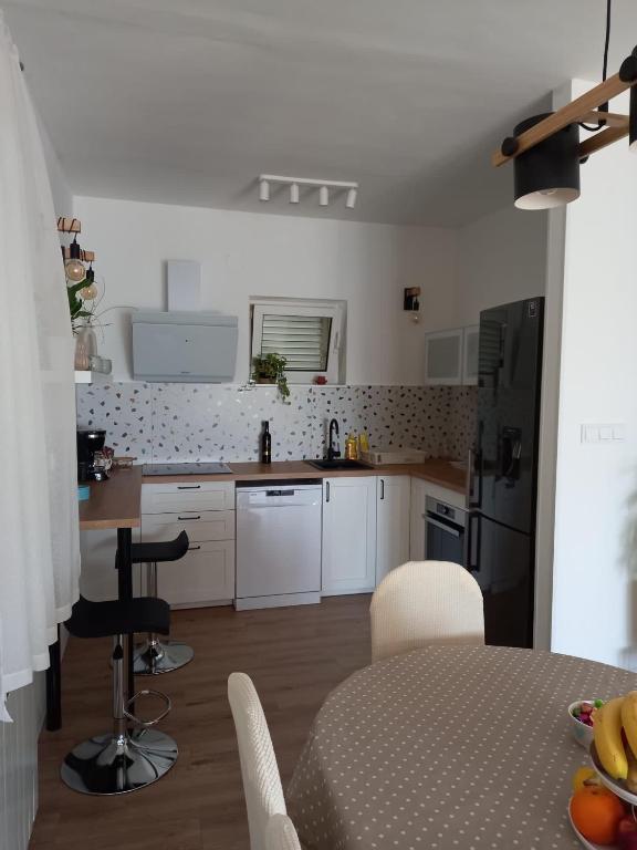 Kuchyň nebo kuchyňský kout v ubytování Apartman Betty
