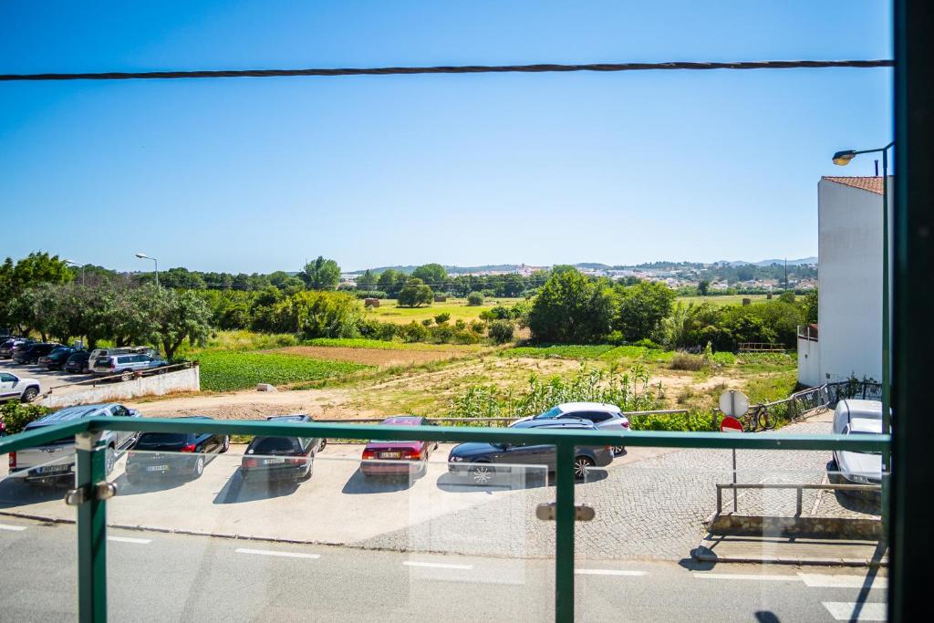 a balcony with a view of a parking lot at Guesthouse Aljezur Center in Aljezur