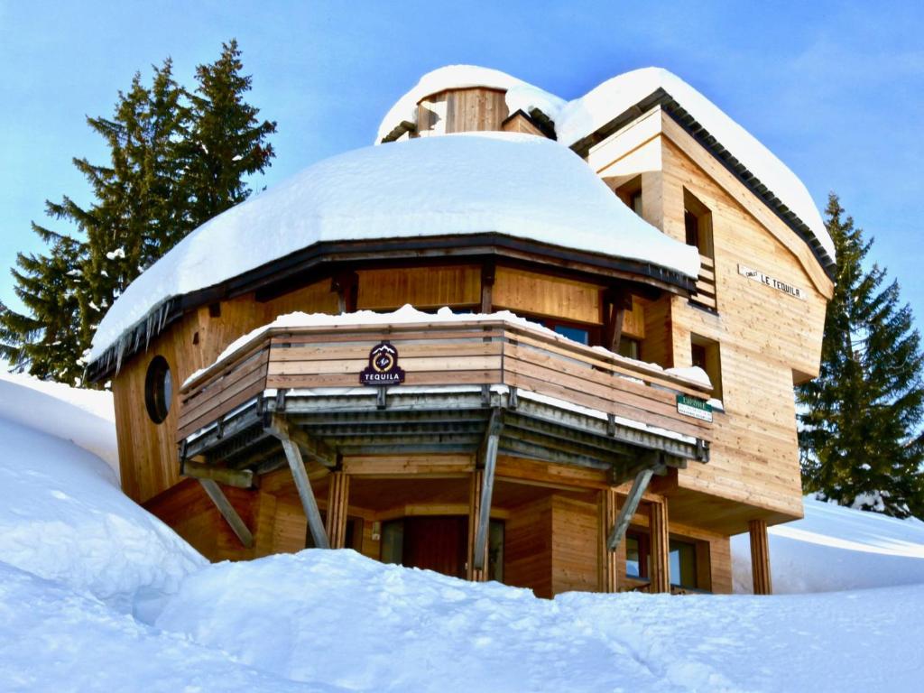 a building covered in snow with trees in the background at Chalet Avoriaz, 5 pièces, 10 personnes - FR-1-314-193 in Avoriaz