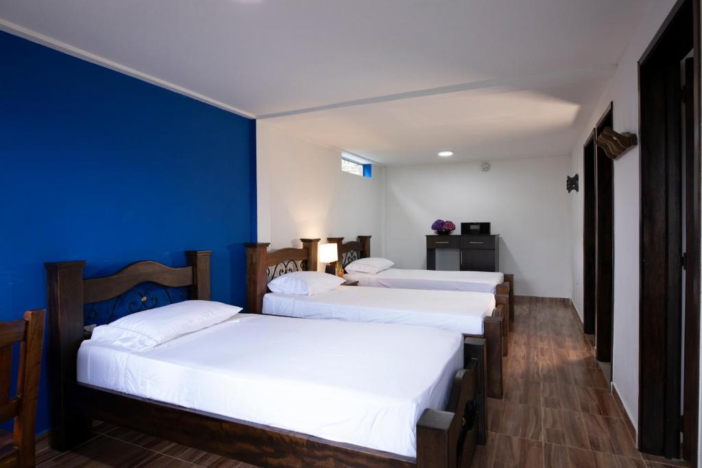 Postel nebo postele na pokoji v ubytování HOTEL YANUBA CAMPESTRE