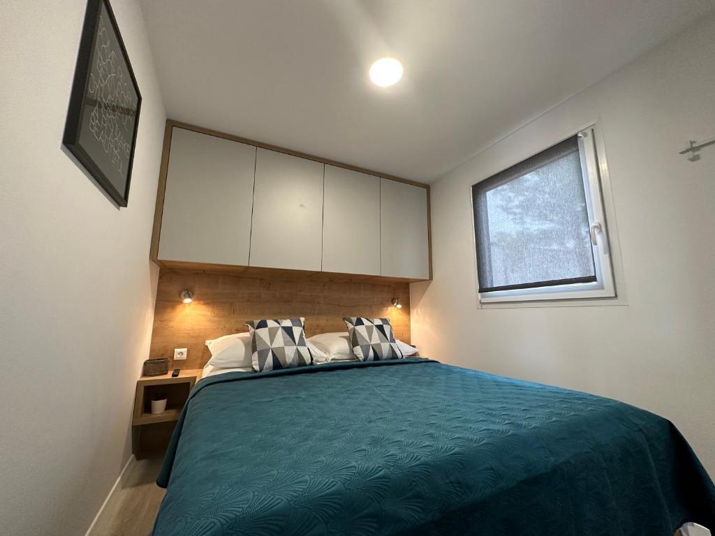 Postel nebo postele na pokoji v ubytování Mobile home Mare Blu