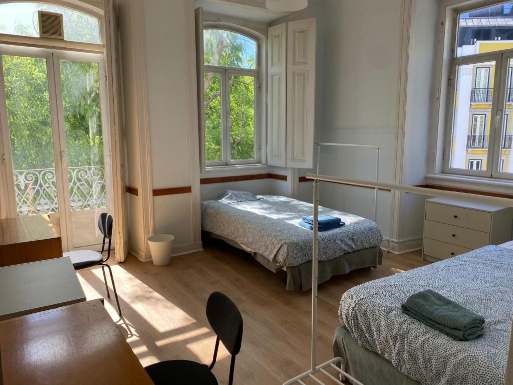 Postel nebo postele na pokoji v ubytování Room in Lisbon centre