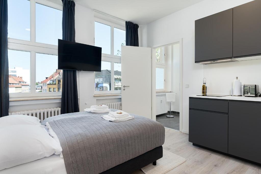 Postel nebo postele na pokoji v ubytování BRIGHT Hildesheim Angoulemeplatz