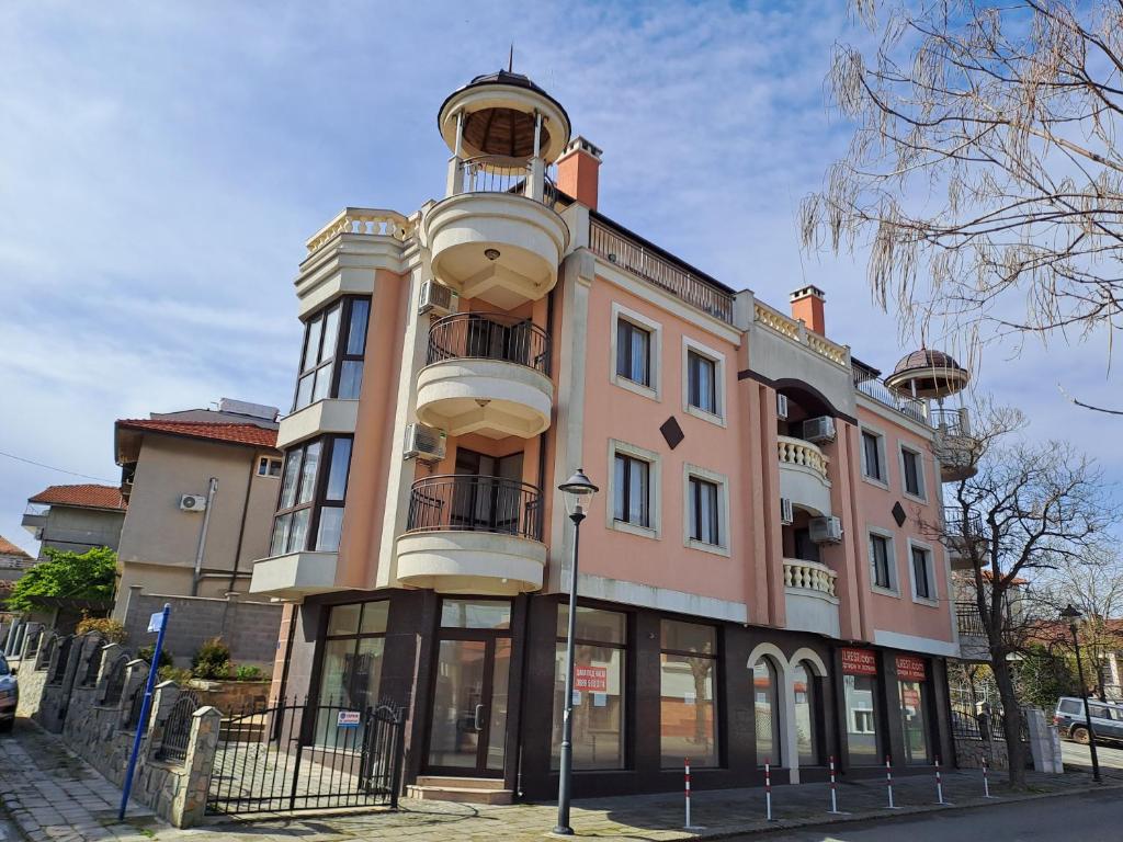 a building with a tower on top of it at Luxury Apartments Ekaterina in Chernomorets