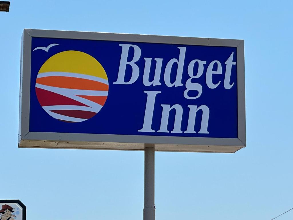 a sign for a burger inn at Budget inn in Kingsville