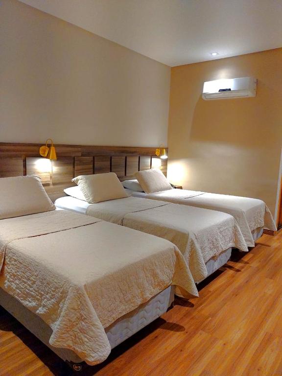 Postel nebo postele na pokoji v ubytování Guess Hotel & Motel