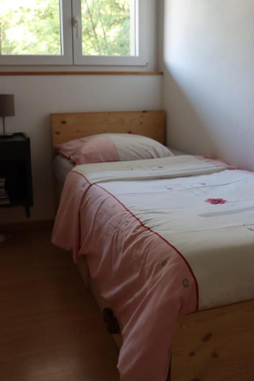 Postel nebo postele na pokoji v ubytování Comme sur un nuage, appartement pour 4 personnes