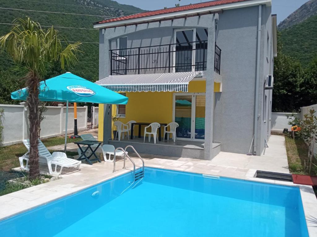 a villa with a swimming pool and a house at House with pool - Mitrovic in Herceg-Novi