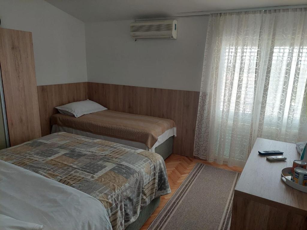 Una cama o camas en una habitaci&oacute;n de Diana Rooms and Apartments