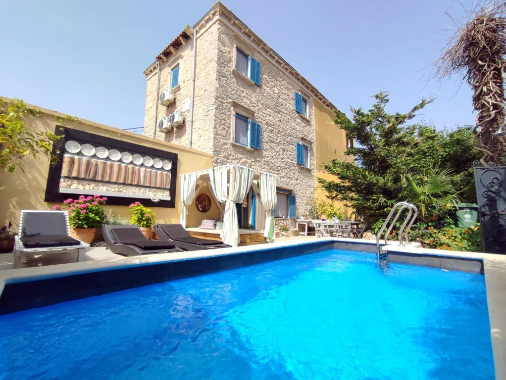 a swimming pool in front of a building at Villa Lido 145 m2 with pool in Krnica