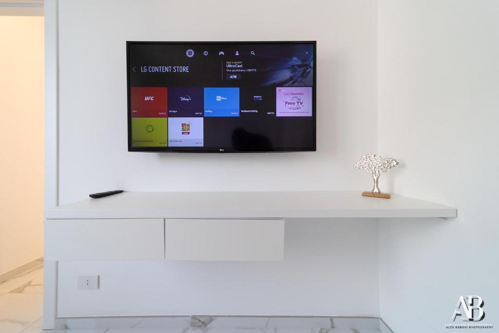 A television and/or entertainment centre at [Suite Aurora] Luxury in the center of Sanremo