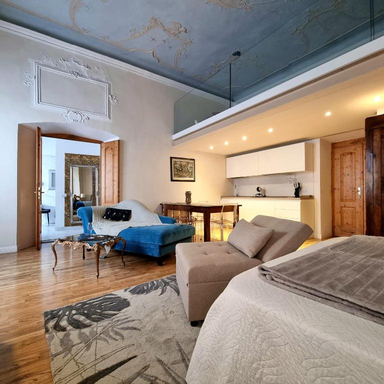 a bedroom with a bed and a living room at 1Dest - Living The Dream in Arco