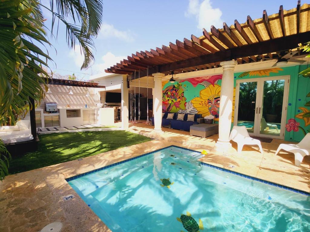 a swimming pool in the backyard of a house at Relaxing Oasis with Pool heater and Cabana in San Juan