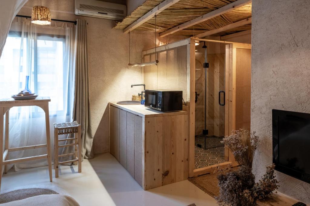 Kuchyň nebo kuchyňský kout v ubytování Biophilia Luxury Lofts