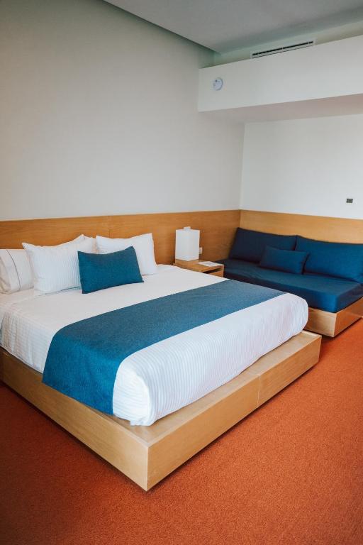 Postel nebo postele na pokoji v ubytování Gran Hotel Concordia
