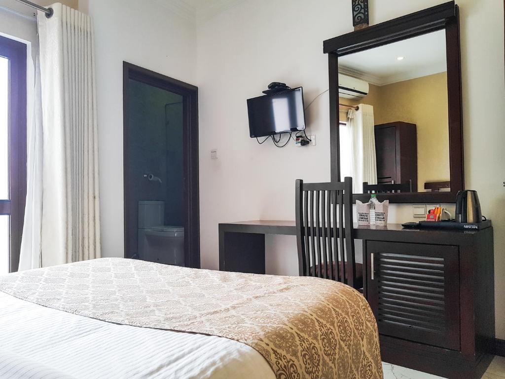 Postel nebo postele na pokoji v ubytování Galaxy City Hotel