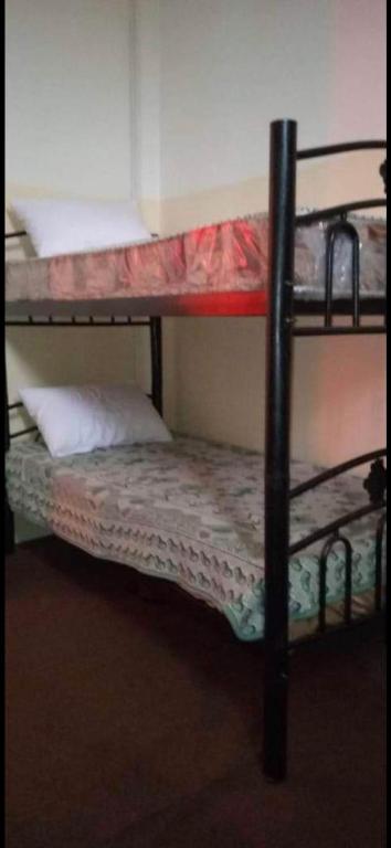 Una cama o camas en una habitación de Jawal Hotel