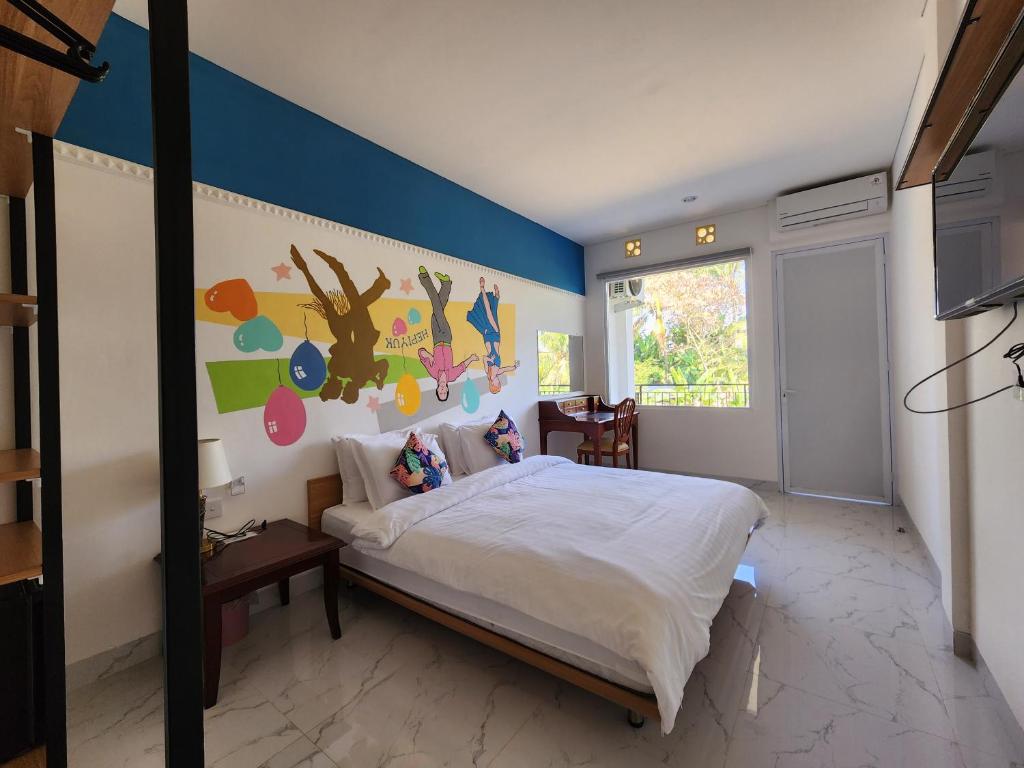Postel nebo postele na pokoji v ubytování Hepi Yuk Ubud Luxury Guesthouse