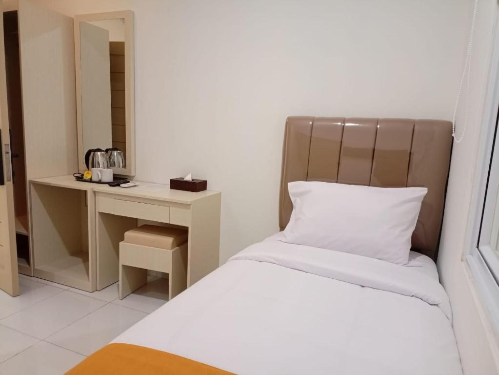 Postel nebo postele na pokoji v ubytování Batik Oma House