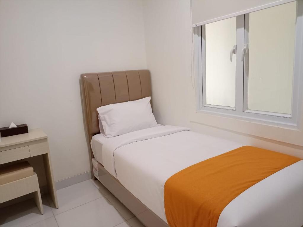 Postel nebo postele na pokoji v ubytování Batik Oma House