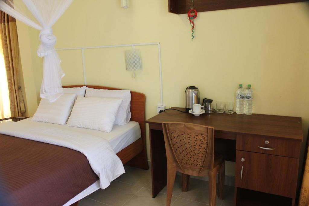 Postel nebo postele na pokoji v ubytování Welcome Inn