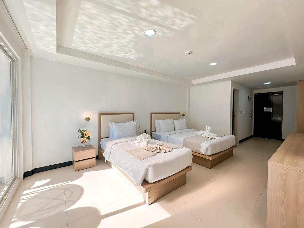 Postel nebo postele na pokoji v ubytování 라메디 리조트 보홀 Ramede Resort Bohl