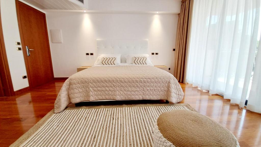 Posteľ alebo postele v izbe v ubytovaní Hotel & Wellness Fra I Pini