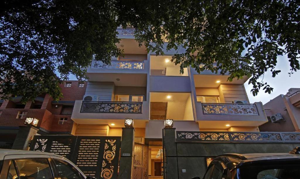 a building with two balconies on the side of it at Hotel Aviraj Inn in Kalkaji Devi