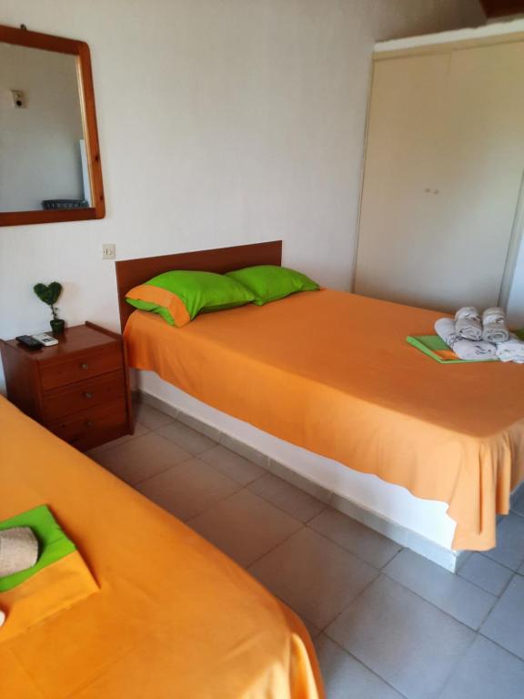Postel nebo postele na pokoji v ubytování Bungalows anestis