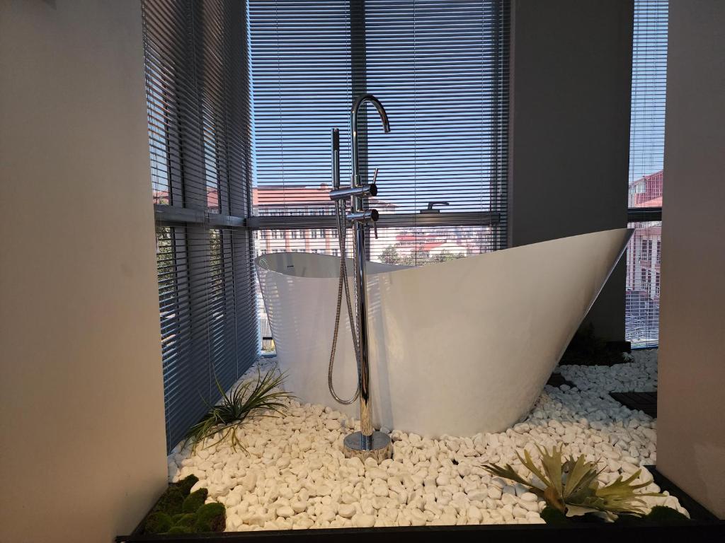 a bath tub in a bathroom with a window at Dream house 22 in Istanbul