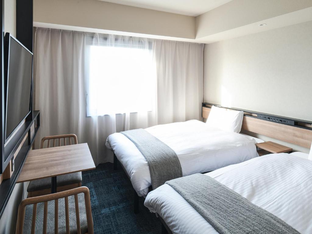 Postel nebo postele na pokoji v ubytování REF Kansai Airport by VESSEL HOTELS
