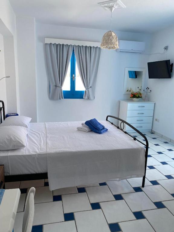 Postel nebo postele na pokoji v ubytování GIAVASI SEASIDE FINIKI